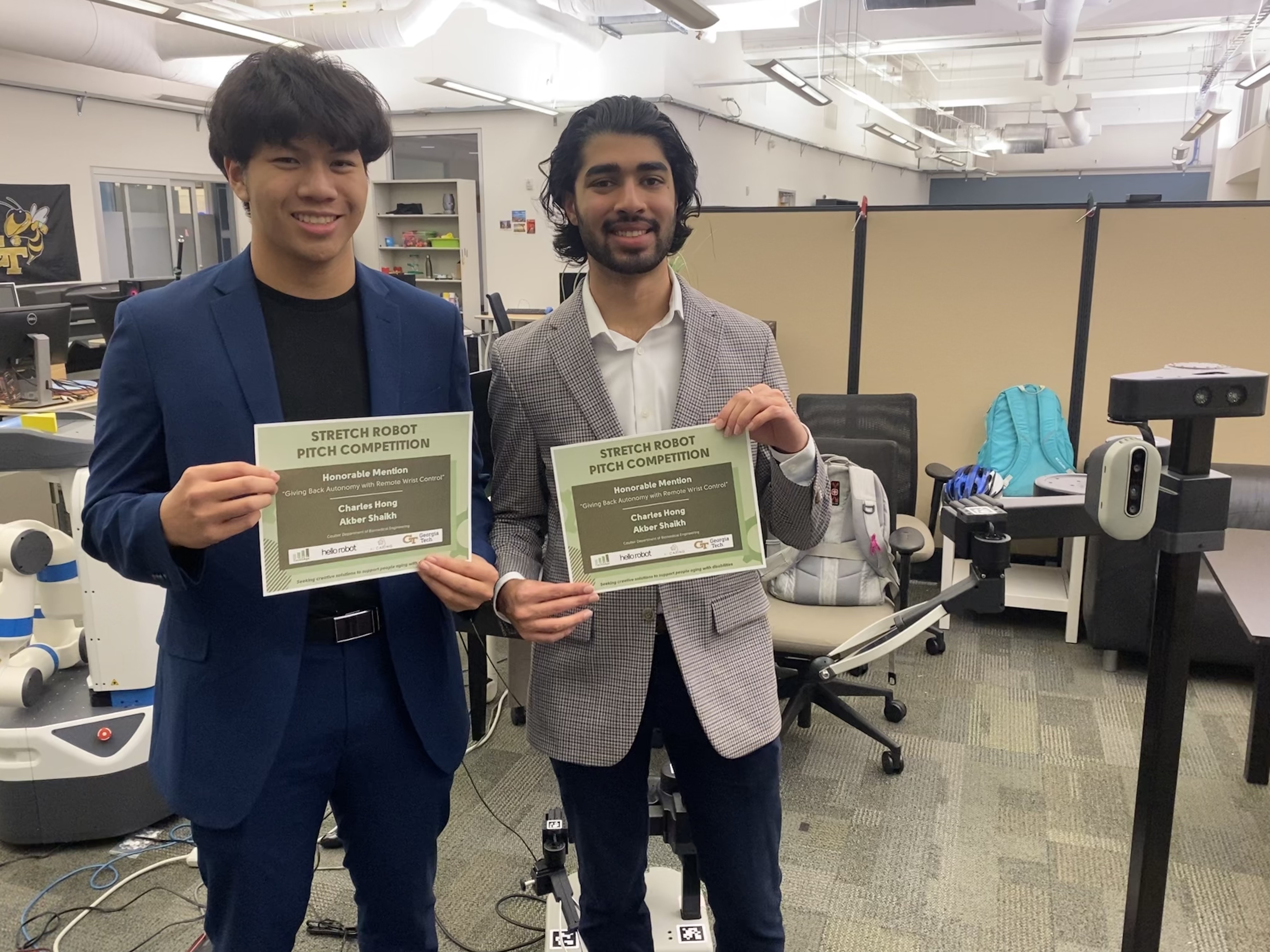 Charles Hong and Akber Shaikh hold the honorable mention certificate by Stretch